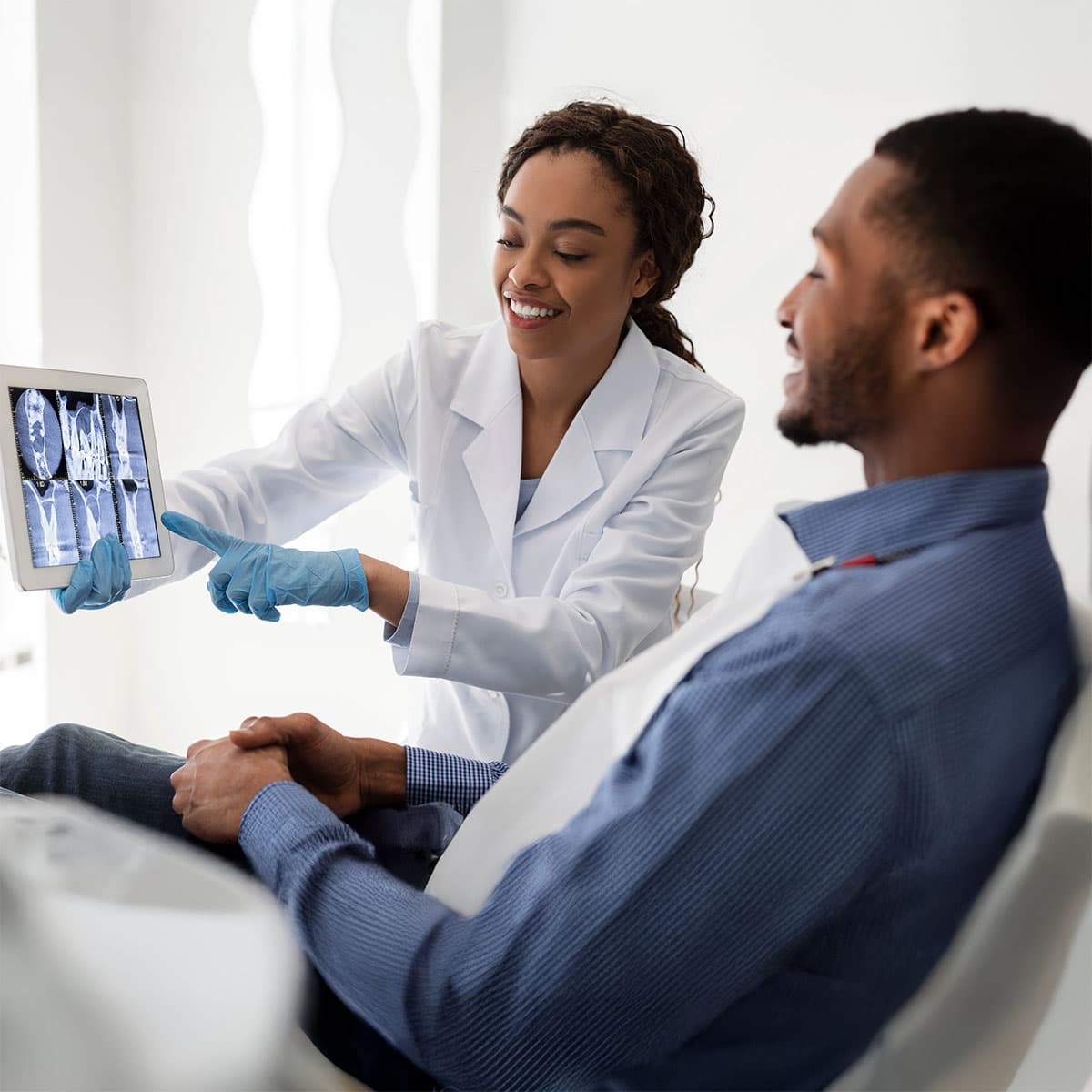 Image of doctor showing patient x-ray images
